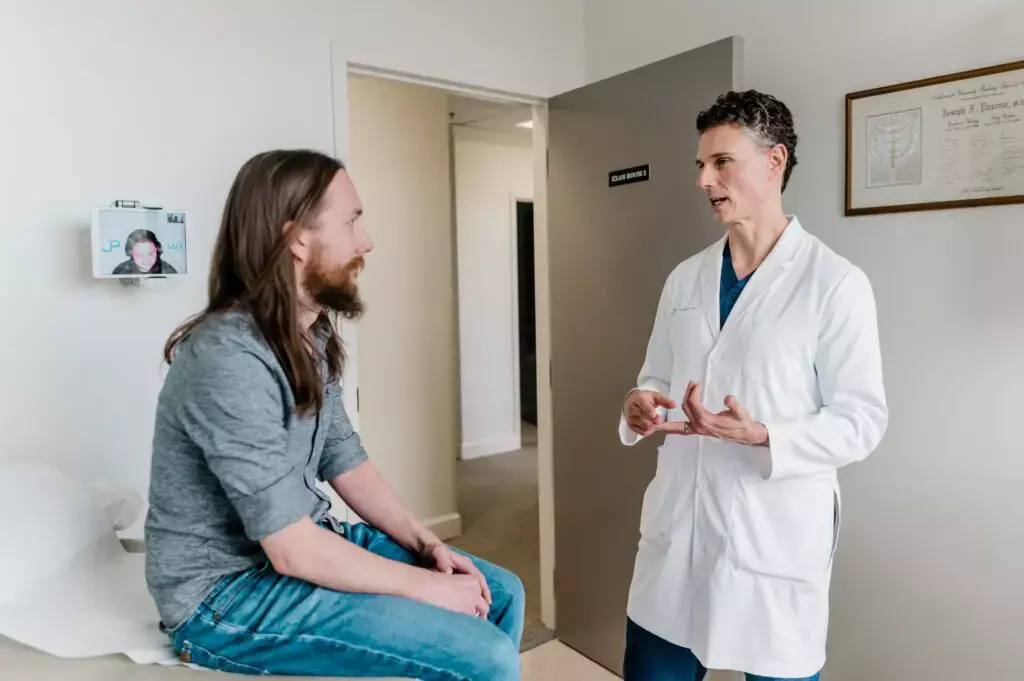 Dr. Pazona talking to patient
