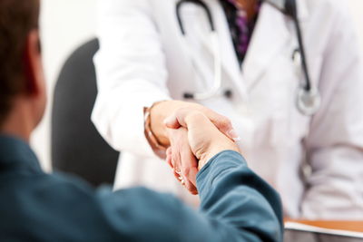 man shaking doctor's hand