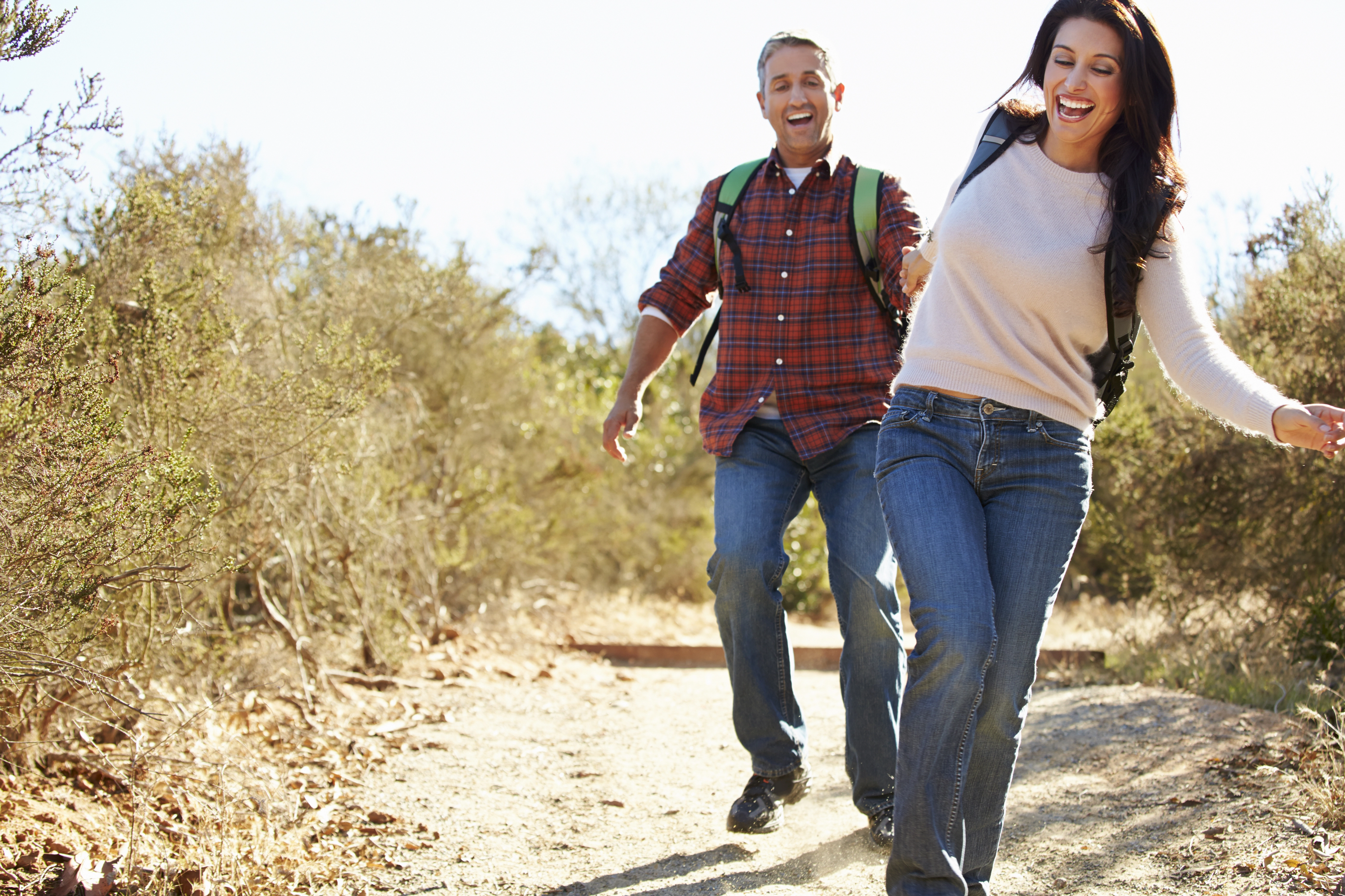 smiling couple hiking
